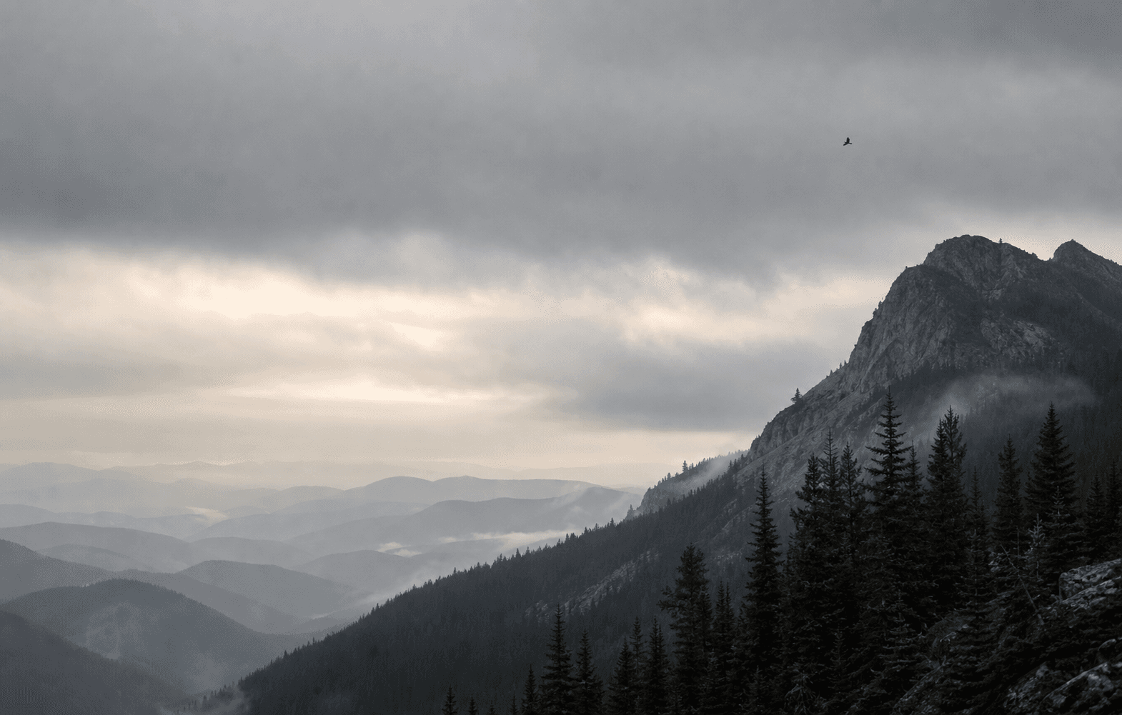 A distant mountain horizon under a quiet overcast sky